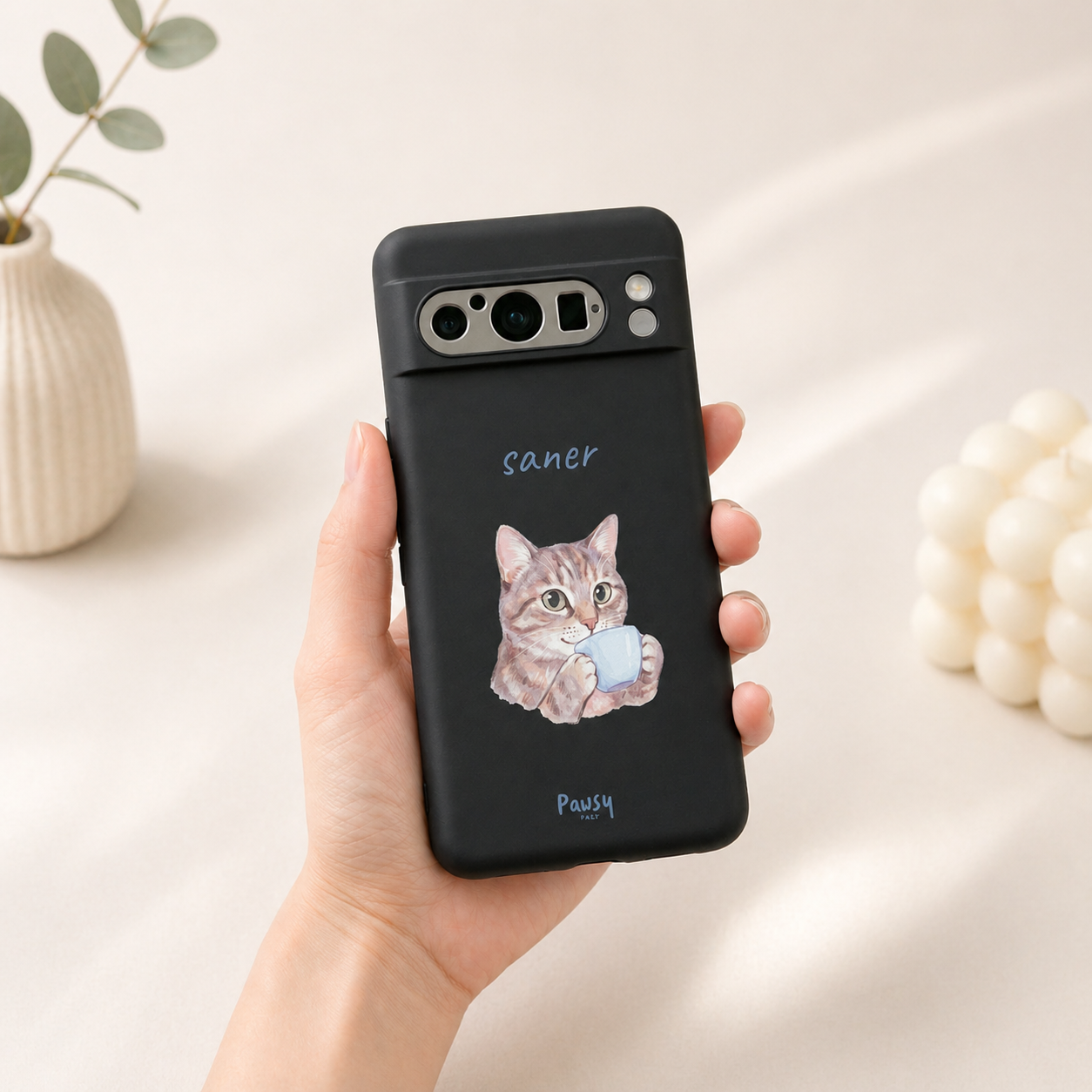 Phone case with a cat drinking coffee design held by a hand, cat's name printed on the case, watercolor pet portrait design by Pawsy Pals